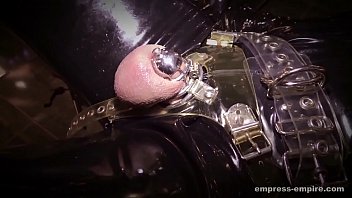 Rubber slave locked in mini chastity