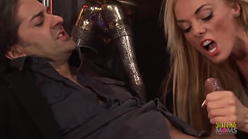 A milf with blonde hair and big boobs is poledancing before having a hard fuck and a cumshot