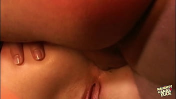 Two individuals one blonde and one brunette engage in sexual activity including a large dildo and a penis