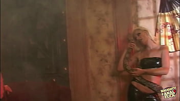 Two individuals one blonde and one brunette engage in sexual activity including a large dildo and a penis