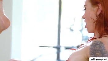 Tall redhead shows her talent in massage to her co that they get horny and start kissing and licking each others pussy