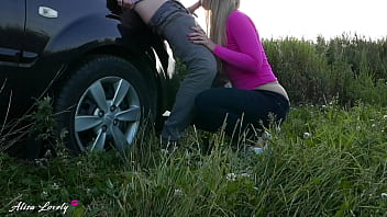 Blonde sucks cock and fucks standing doggy style in field in sunset lights