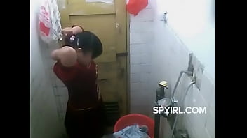 girls remove dress in bathroom