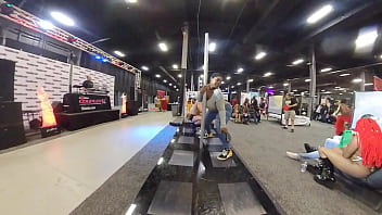 topless girl dancing on stage with band