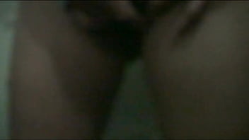 Jade on the ground behind the door with a visitor at home