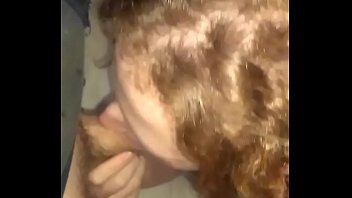 Curly redhead sucks passionately