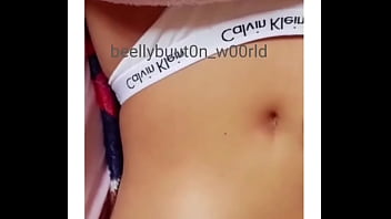 The first video playing with her belly button