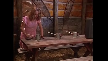 A strong guy fucks his leggy captive in a dog pose and cums on her face