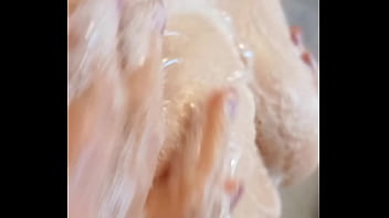 Sexy mature lathers her nipples in the shower