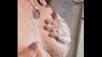 Sexy mature lathers her nipples in the shower