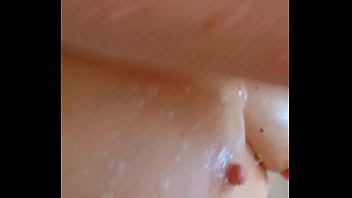 Sexy mature lathers her nipples in the shower