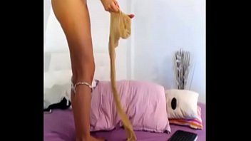 Model in tan pantyhose lick her nylon feet