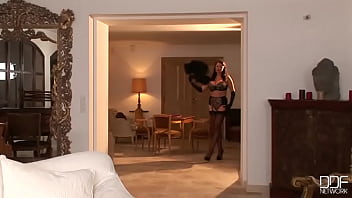 Busty brunette poses her sexy legs