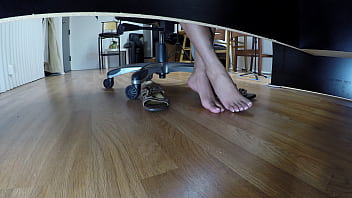 Slut jerks off dudes cock with her feet