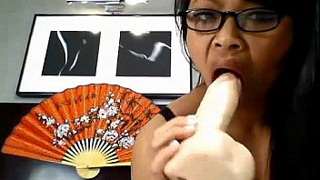 Asian teen nerd sucks a dildo