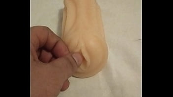 Playing with artificial pussy