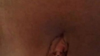 Young busty brunette teases clit with toys on