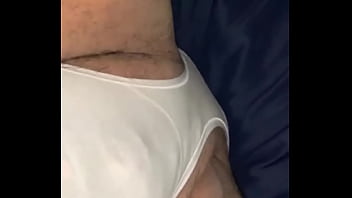 Guy Modeling White Panties In Bed thumbnail