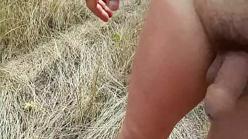 Handsome man is walking naked on the public park