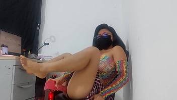 Sweet girl in miniskirt and fishnet stockings takes a huge horse dildo