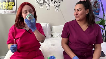 Hot nurses in scrubs mess around with gloves
