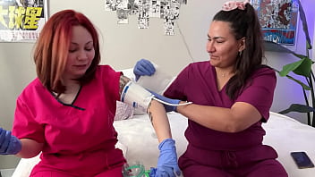 Hot nurses in scrubs mess around with gloves