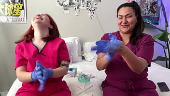 Hot nurses in scrubs mess around with gloves