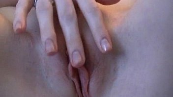 Cute redhead teen strips and spreads pussy