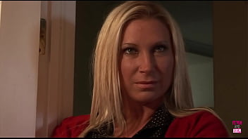 A man exercises control over a well endowed blonde woman who is restrained in the restroom A man exercises control over a well endowed blonde woman who is restrained in the restroom