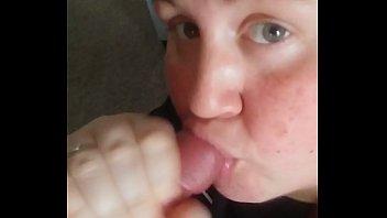 Down on her knees licking his balls