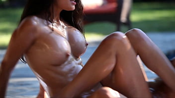 Lesbian brunettes scissor and eat pussy by the pool