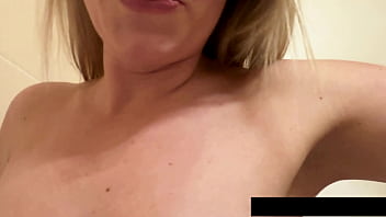 Claudia's playful bathroom selfie