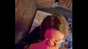 Chained to the wall and on her knees ready to suck