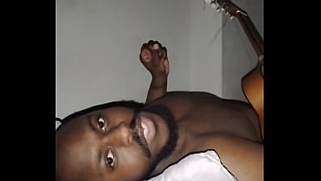 Translating other meanings of horns in the air while singing and playing guitar naked