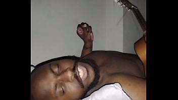 Translating other meanings of horns in the air while singing and playing guitar naked