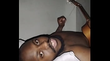 Translating other meanings of horns in the air while singing and playing guitar naked