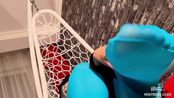 Long sexy legsand feet in blue nylons swings in a hanging chair above you