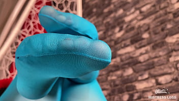 Long sexy legsand feet in blue nylons swings in a hanging chair above you