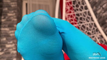 Long sexy legsand feet in blue nylons swings in a hanging chair above you