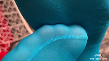 Long sexy legsand feet in blue nylons swings in a hanging chair above you