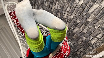 Long sexy legsand feet in blue nylons swings in a hanging chair above you