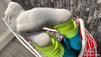 Long sexy legsand feet in blue nylons swings in a hanging chair above you