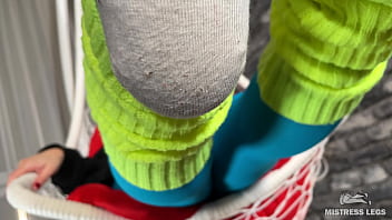 Long sexy legsand feet in blue nylons swings in a hanging chair above you