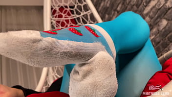 Long sexy legsand feet in blue nylons swings in a hanging chair above you