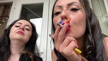 Dominas sexy and blowing into the camera