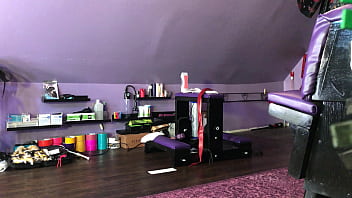 Dominatrix waxing man;s legs