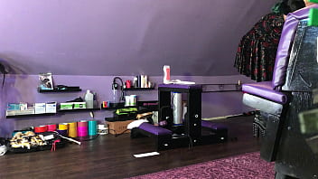 Dominatrix waxing man;s legs