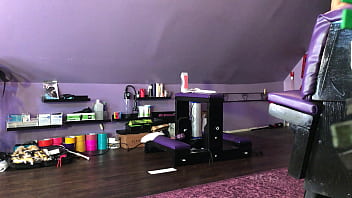 Dominatrix waxing man;s legs