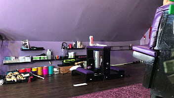 Dominatrix waxing man;s legs