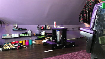 Dominatrix waxing man;s legs